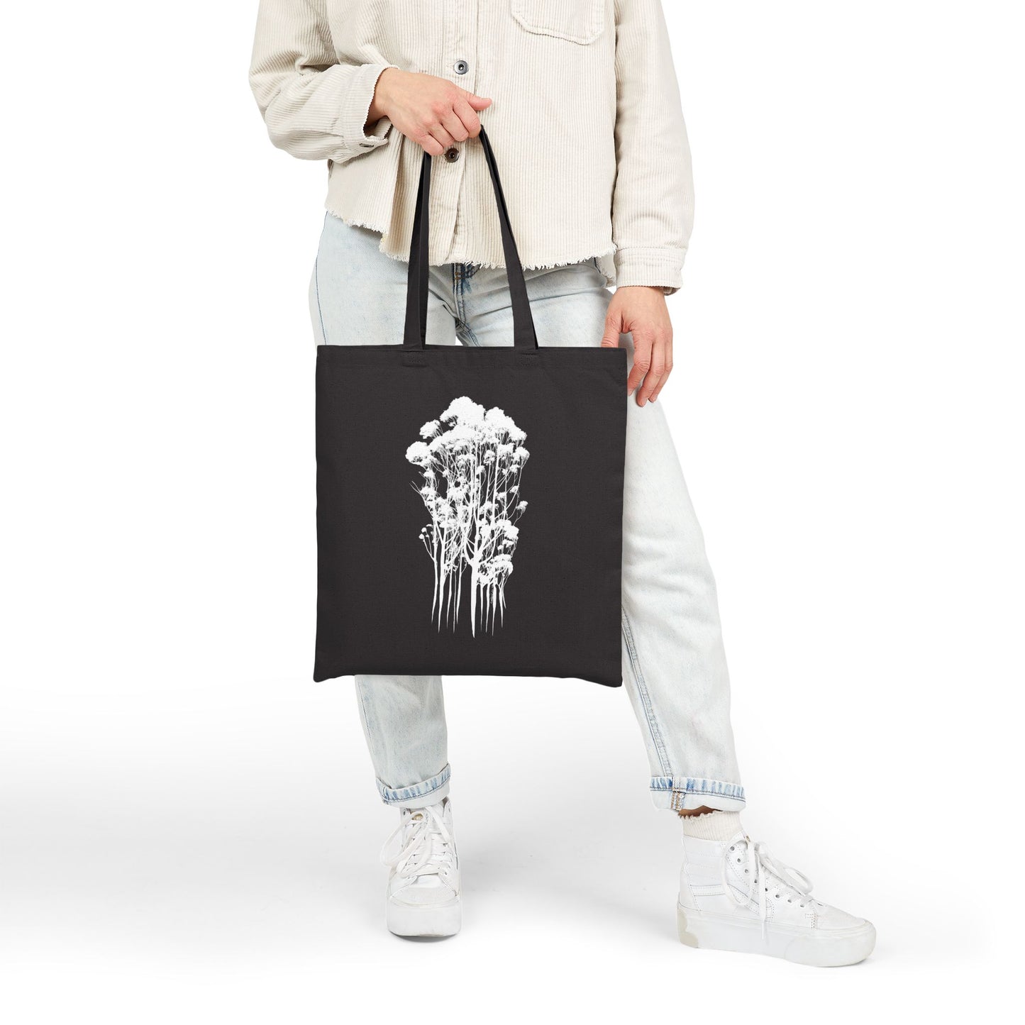 Eco-Friendly Cotton Canvas Tote Bag with Delicate Trees Drawing in black held in front