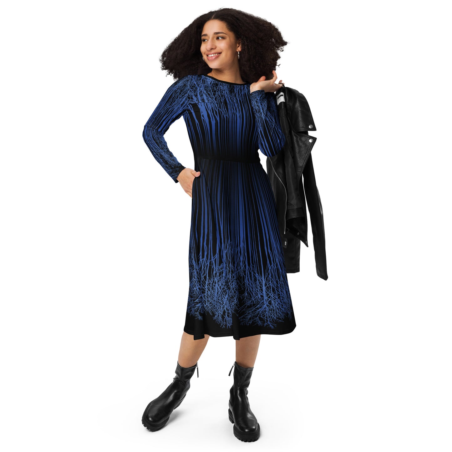 A woman wearing the Down Trees Long Sleeve Midi Dress by Michelle Penland Dodson