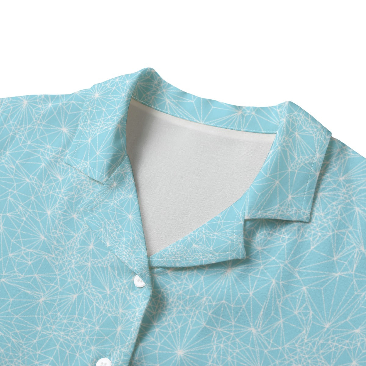 Close-up of a light blue patterned shirt with a white collar on a white background