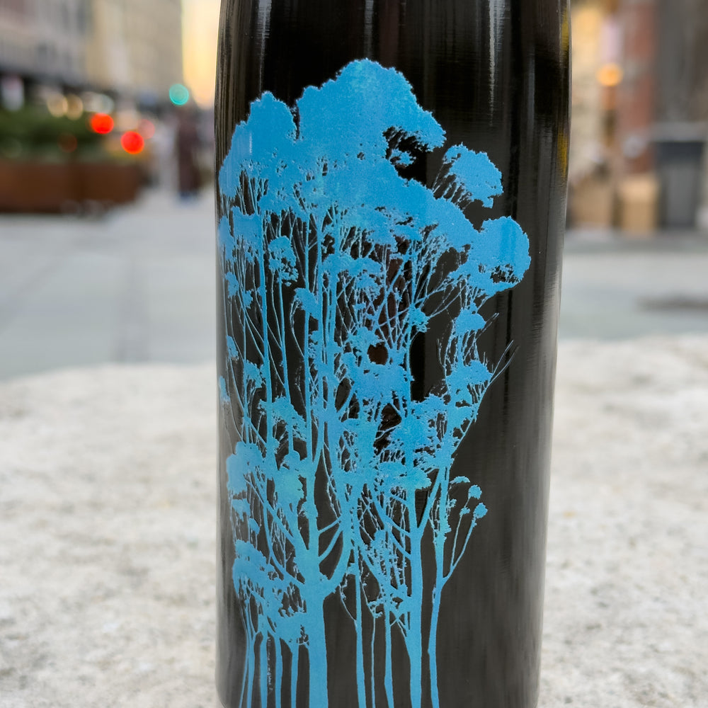 Detail photo showing the lovely slightly raised surface on the Delicate Trees water bottle by Michelle Penland Dodson.