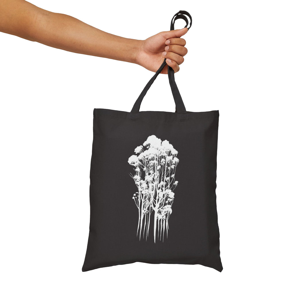 Eco-Friendly Cotton Canvas Tote Bag with Delicate Trees Drawing in black held in hand