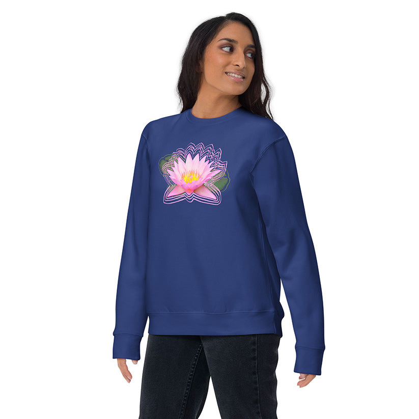 Woman wearing a blue sweatshirt with a pink flower design on a white background