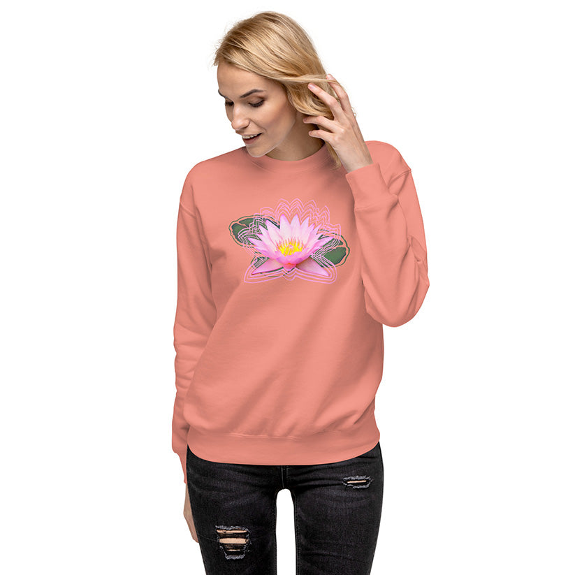 Person wearing a pink sweatshirt with a flower design on a white background