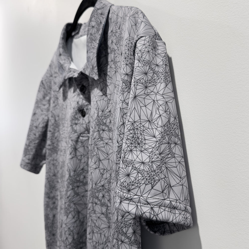 Closeup of shoulder of Tri-Geometric all over pattern Polo Style Golf Shirt