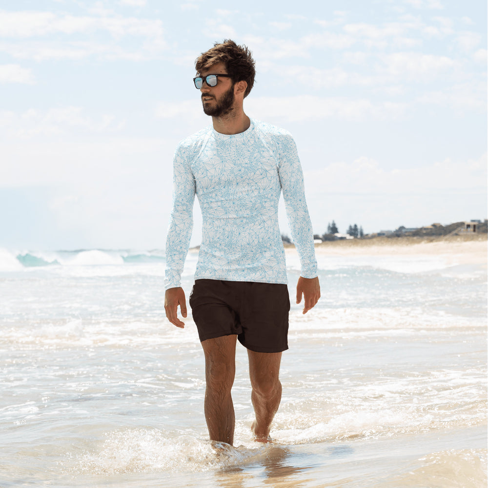 Man at the beach wearing mens uv protection long sleeve shirt with tri-mesh geometric pattern