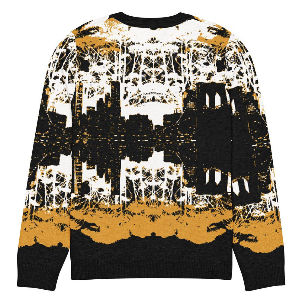 Back view of Sweater with abstract NYC cityscape design in black, white, and gold on a white background