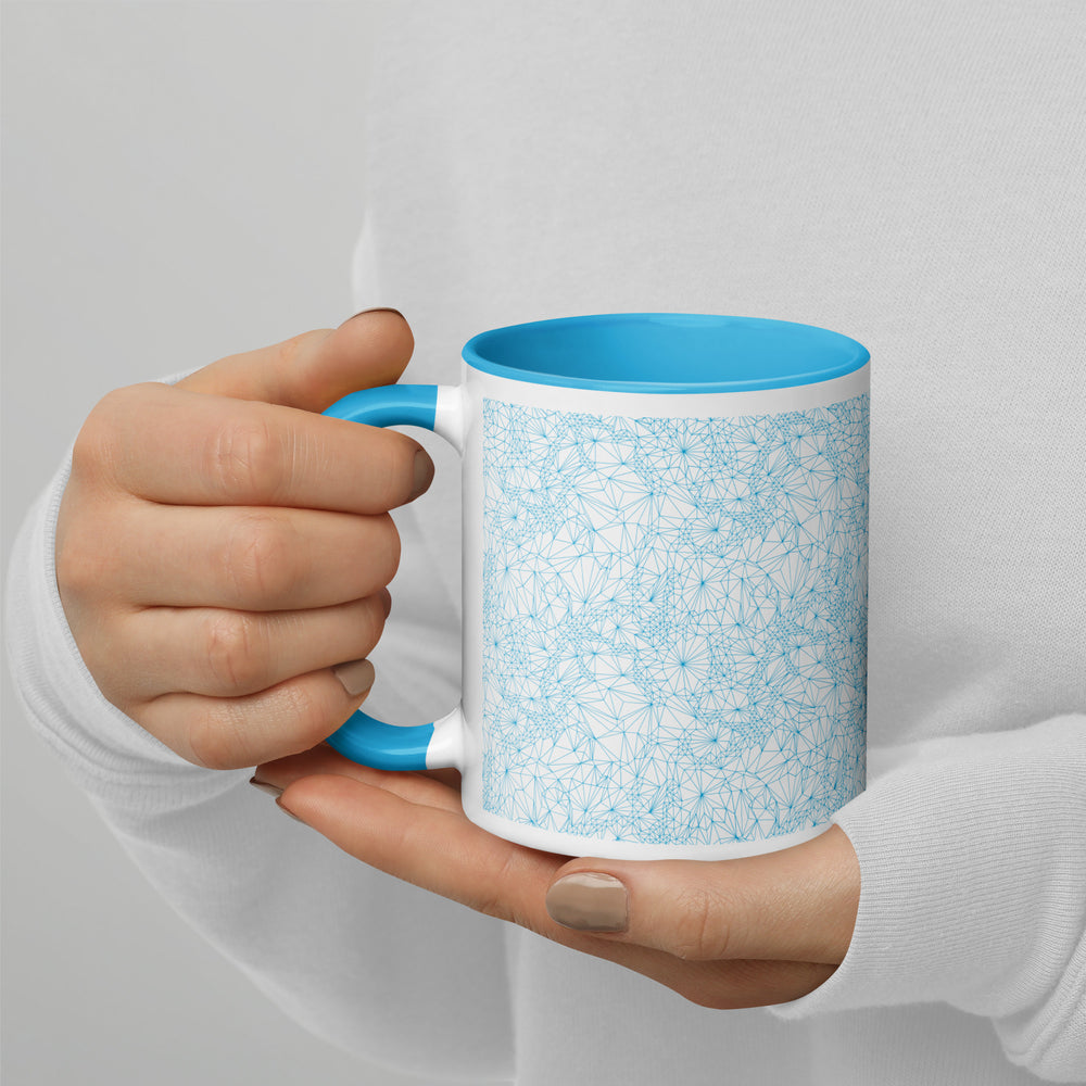 Woman holding 11 ounce Blue Tri-Mesh Geometric Mug with Blue Interior