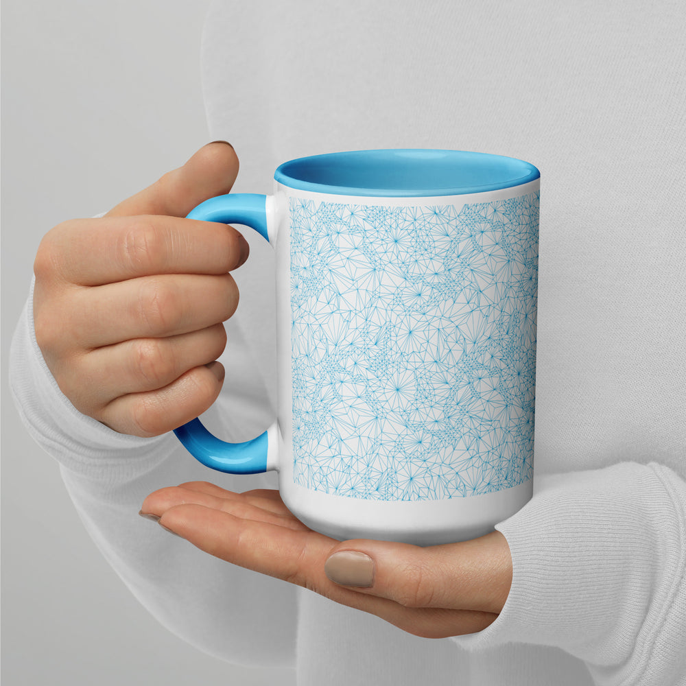 Person holding a 15 ounce Blue Tri-Mesh Geometric Mug with Blue Interior